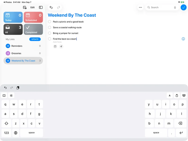 SplitKeyboard being used in Apple Reminders to plan a weekend by the coast, with split keys at each edge of the iPad.